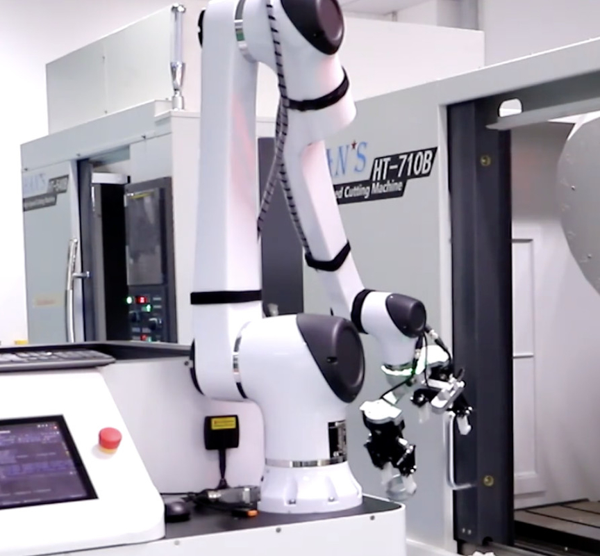 Przemysłowy system układania ramion manipulatora robota do procesu załadunku i rozładunku obrabiarki